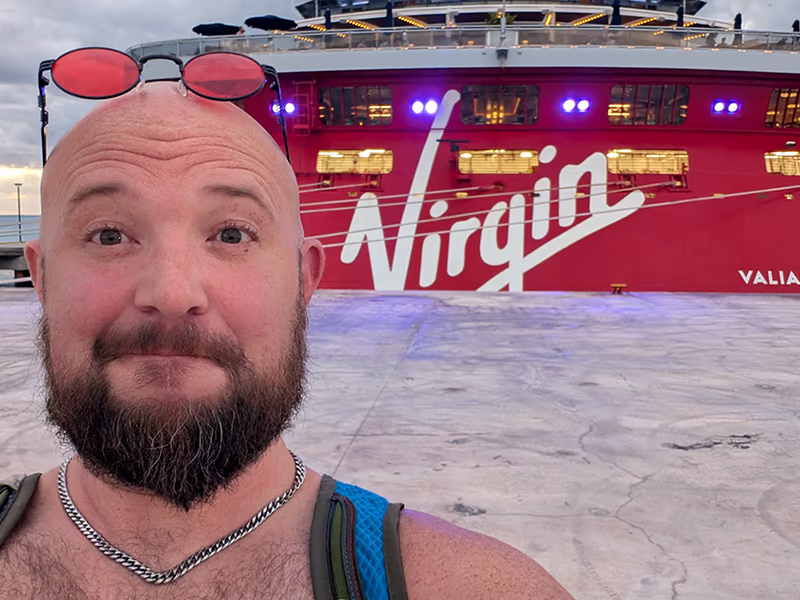 our Group Leader by a Virgin Voyages ship