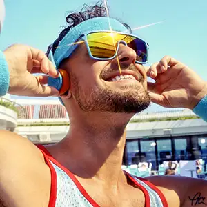 A happy guy listening to music in the sunshine