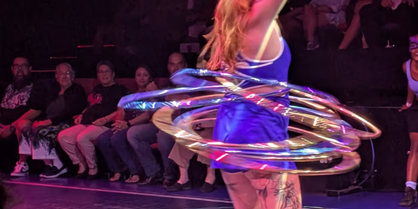 Hoola-hooping girl during a show on Virgin Voyages